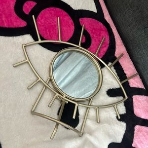 gold eye mirror